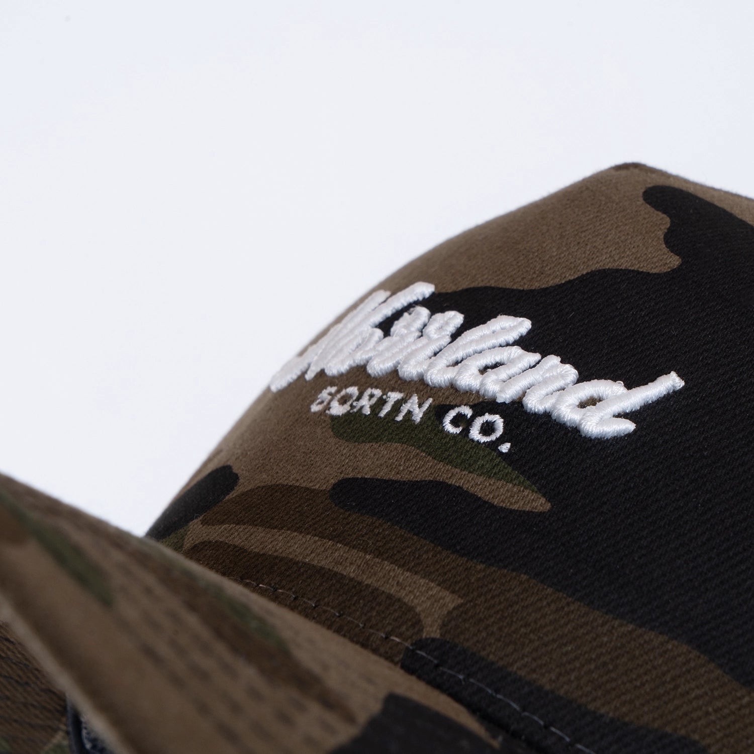 TGN SCRIPT TRUCKER CAP - HOOKED CAMO